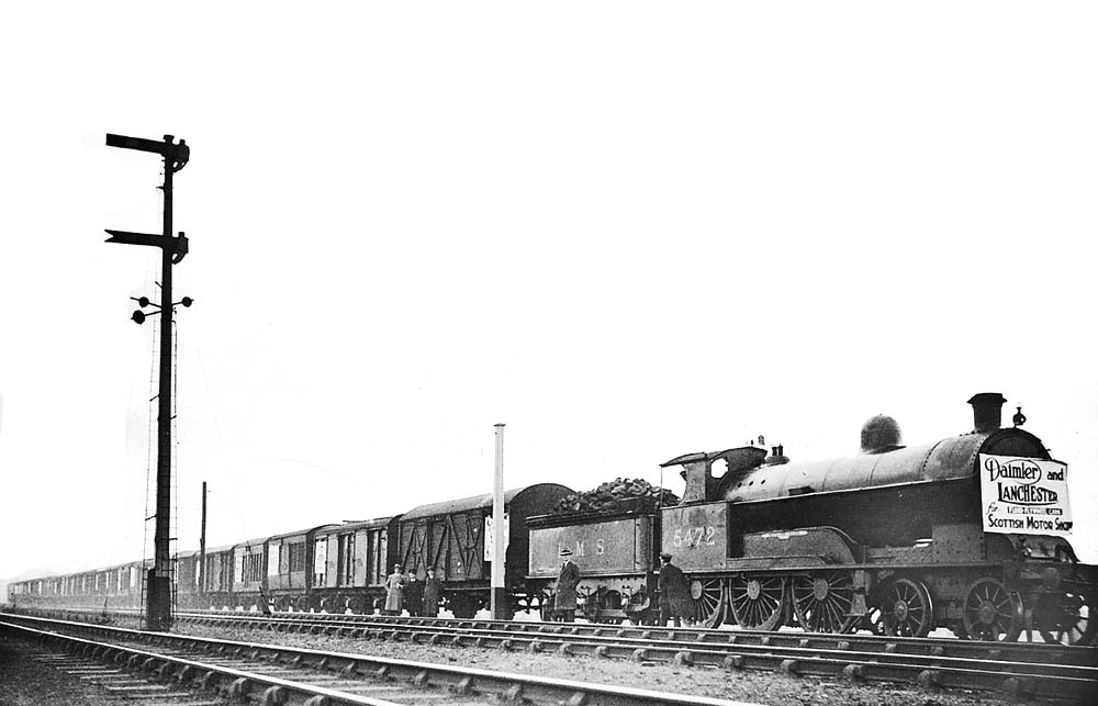 Ex-LNWR 4-6-0 'Experiment		Class' No 5472	'Richard Moon' posers at the head of long train of long-wheelbase vans
