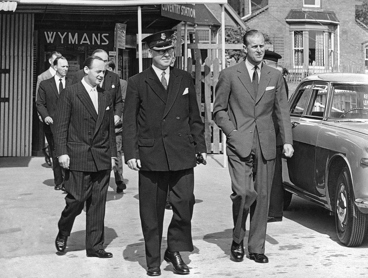 The Duke of Edinburgh, Mr Donald Campbell and Coventry's Stationmaster Mr RW Salt stand outside the station's temporary accommodation on 15th July 1960