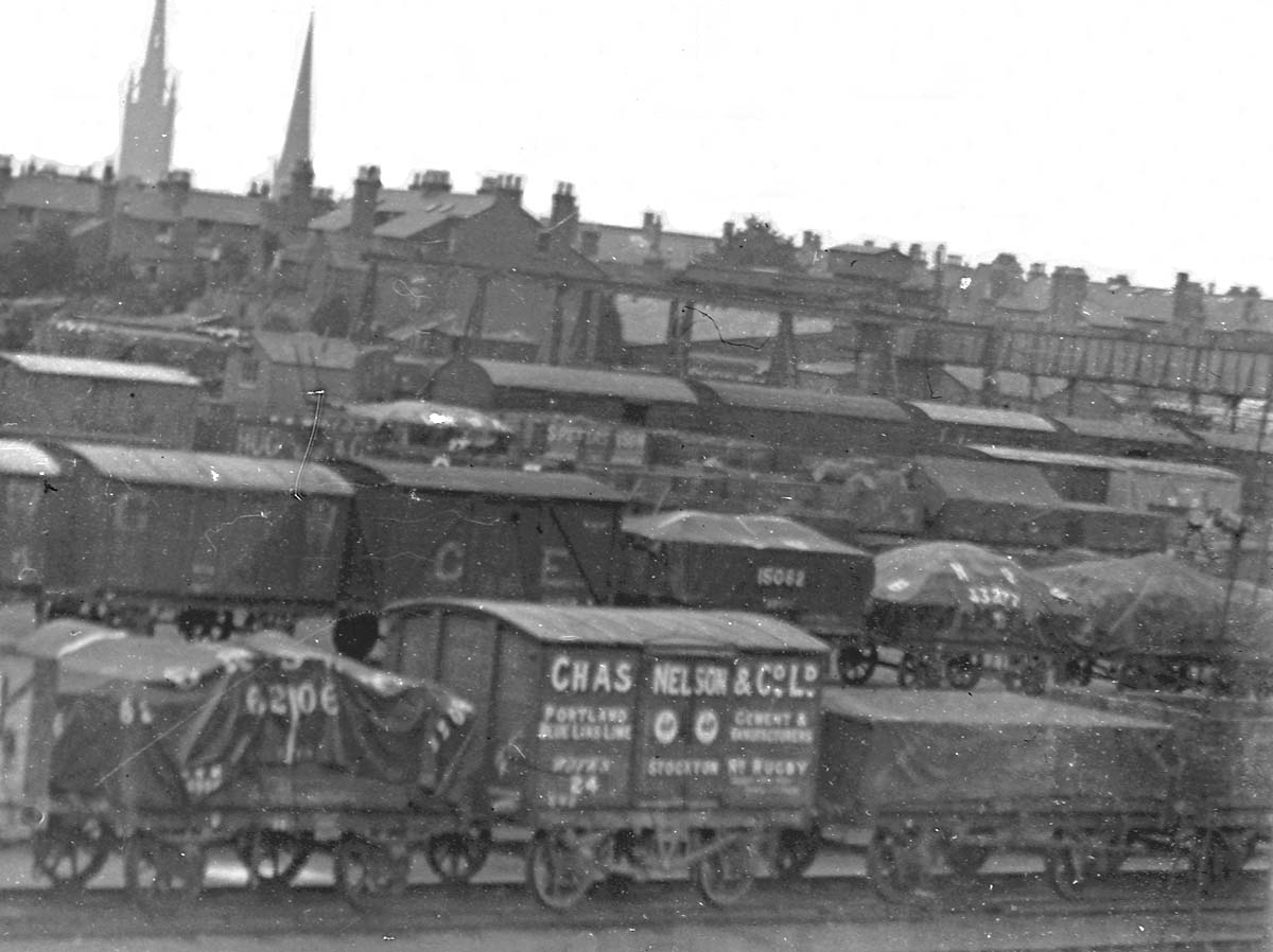Close up showing some of the wagons stabled in Coventry Goods yard including a Great Western and a Great Eastern wagon behind the Chas Nelson & Co Ltd Van