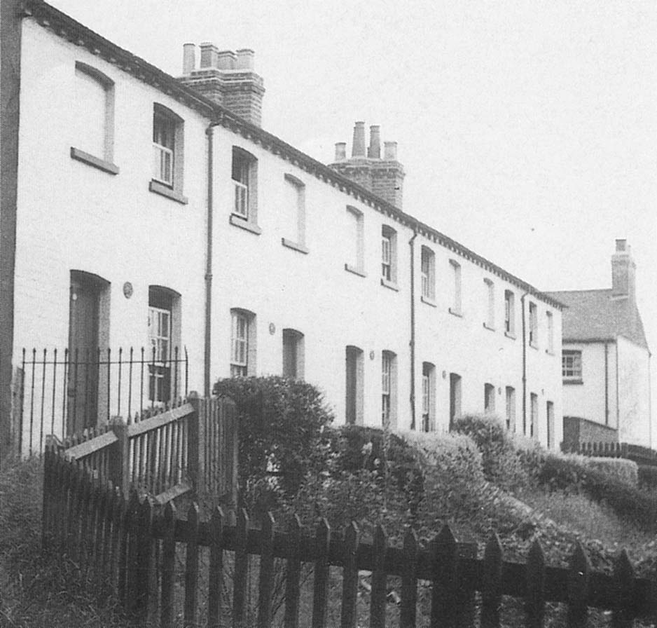 A row of seven London & Birmingham workmen's 'cottages' standing above Warwick Road bridge in 1950s