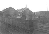 A rake of Loco coal wagons stand on the coaling road adjacent to Coventry's four road shed