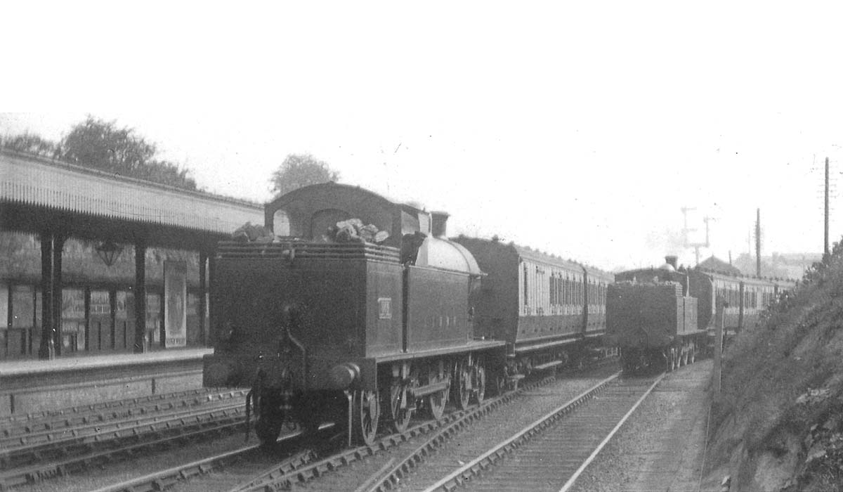 An unidentified LNWR 4-4-2T 'Precursor Tank' runs bunker first through Coventry on the down through line