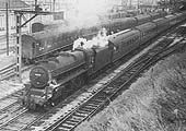 British Railways built 4-6-0 5MT No 44716 is seen pulling out with a Birmingham-bound train consisting of ex-Southern Railway stock