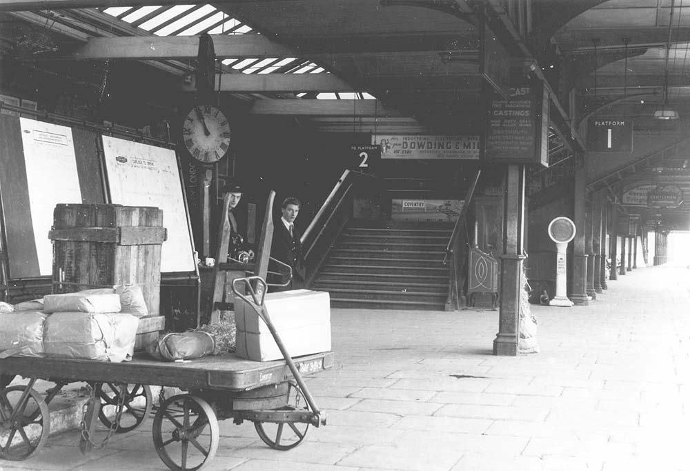 A later view of the Rugby end of the up platform's concourse and the steps to the footbridge to the down platform
