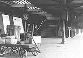 A later view looking towards the Rugby end of the up platform's concourse and the steps to the footbridge to the down platform