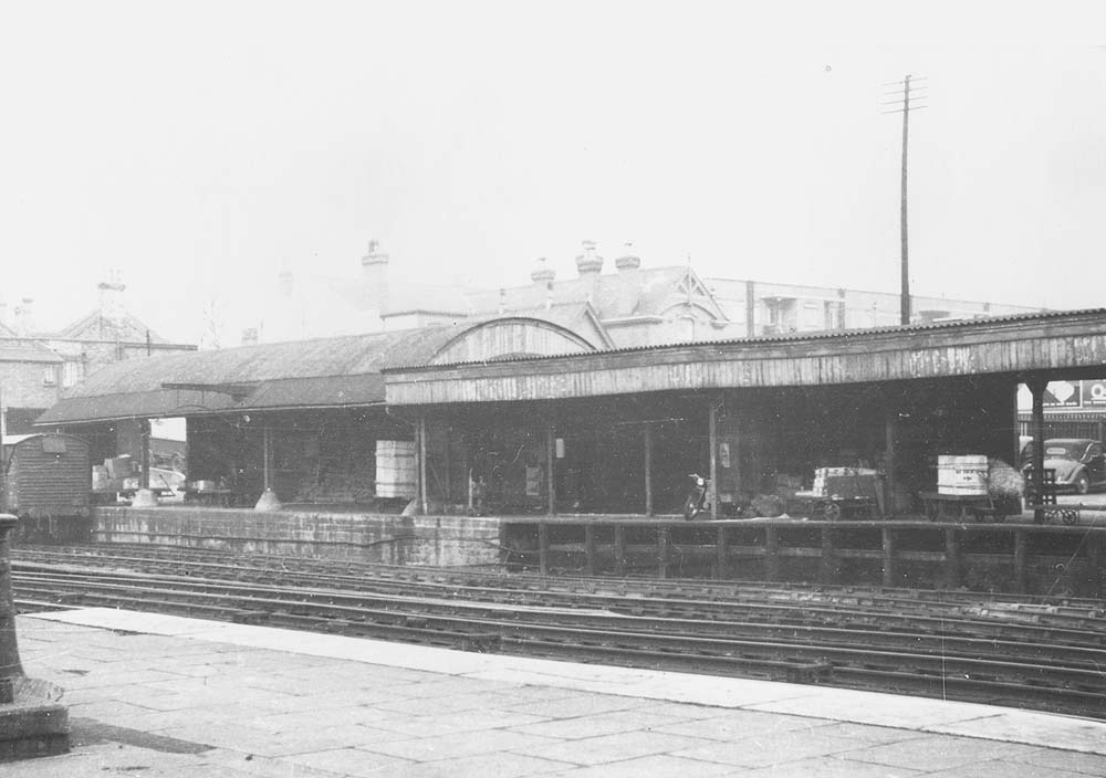 This view looking from the down platform directly towards the Parcels depot illustrates the evolution of the depot and the different types of construction used