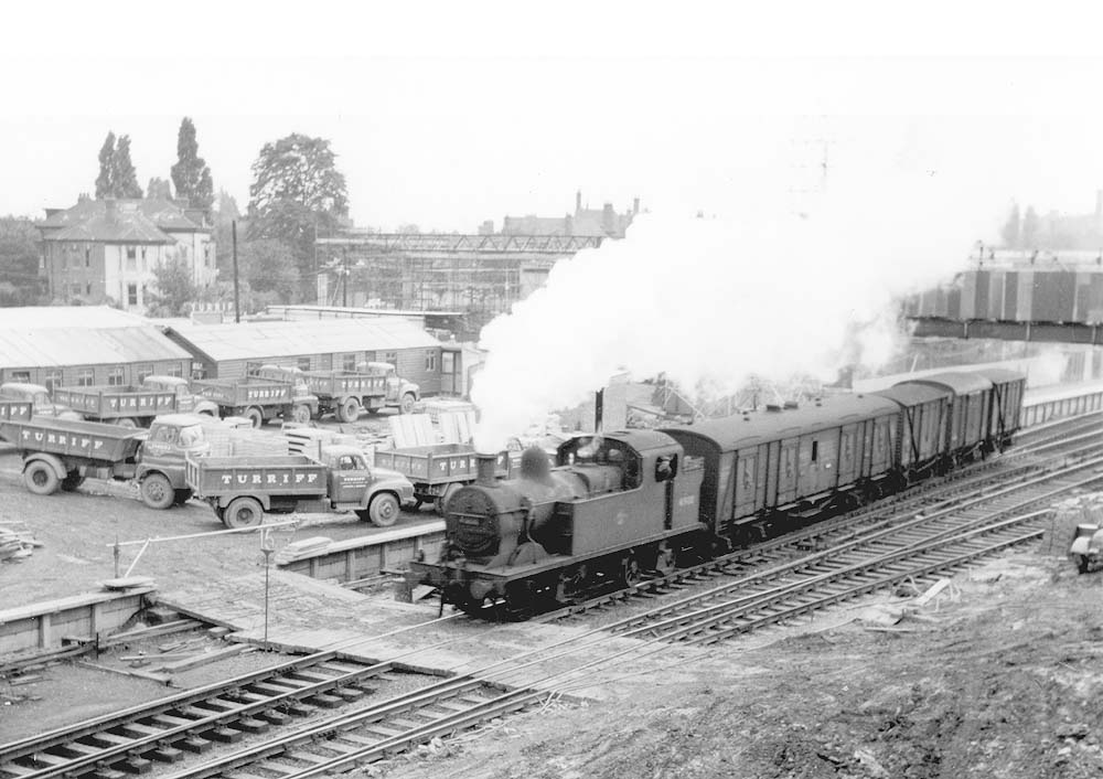 View of ex-LMS 2P 0-4-4T No 41900 is seen running wrong road with a parcels train having just left the new depot