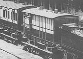 Close up of the LNWR Brake Coach with its guards ducket and lamp on top and an early form of emergency cord