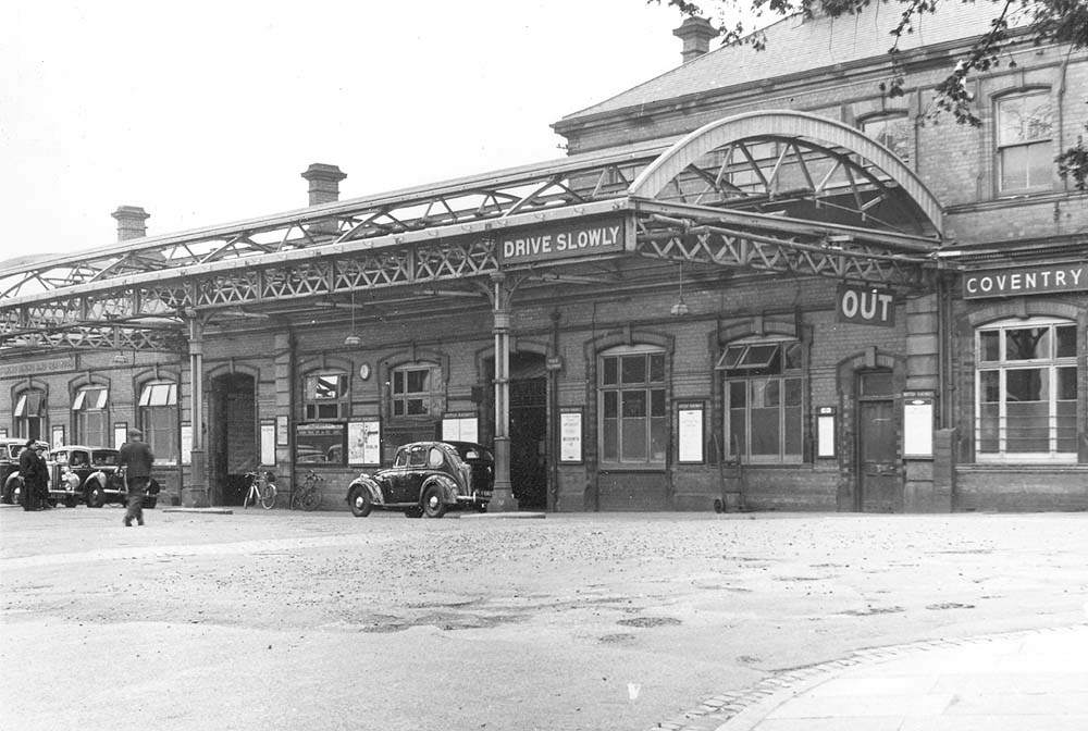 View of the main entrance of Coventry station and the canopy devoid of glazing and showing the traffic signs