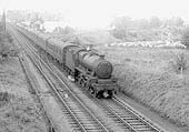An unidentified ex-LMS 5XP 4-6-0 Jubilee class locomotive is seen at the head of a named up express train as it crosses over Humber Road junction