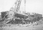 An unidentified LNWR 0-8-0 locomotive is being re-railed after hitting the buffer stops at Folley junction