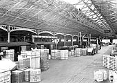An internal view of Curzon Street warehouse's departure platform with various goods being exported