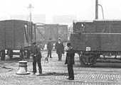 Close up showing one of the powered capstans being operated by a capstanman in order to pull the van