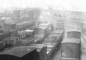 Close up showing Curzon Street No 1 signal cabin and a LNWR train standing on Vauxhall viaduct