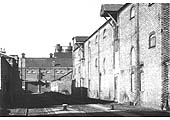 The east end of Top Yard viewed from Curzon Street with the two-storey infirmary stable block at the far end