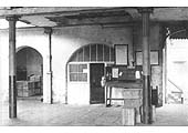 A 1932 view of part of the GJR station's departure platform with the entrance to the booking office in the centre