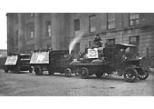 A Commer motor lorry heads a small procession of a steam lorry and an electric powered lorry as part of the parade in September 1918