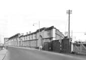 Looking east along Curzon St with the screen wall of the GJR station and the accumulator tower on left