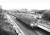 View of Daimler Halt with a Coventry to Nuneaton local passenger train standing at the up platform as passengers board
