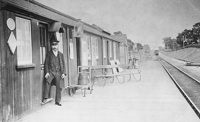 An Edwardian view looking towards Weeden showing in the distance a train approaching the single line platform which is seen on the left