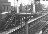 Close up showing the waist height passenger footbridge as well as details relating to the platform's accommodation