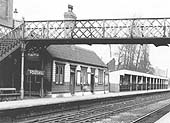 Close up of the buildings on the down platform with the gentlemen's toilet sandwiched between the waiting rooms and the long shelter
