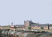 Close up showing mainly coal wagons standing in Foleshill goods yard with the Station Hotel and Lockhurst Lane in the background
