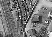 A 1931 aerial photograph of Foleshill Road station's goods yard showing a mix of timber and coal being carried in open wagons