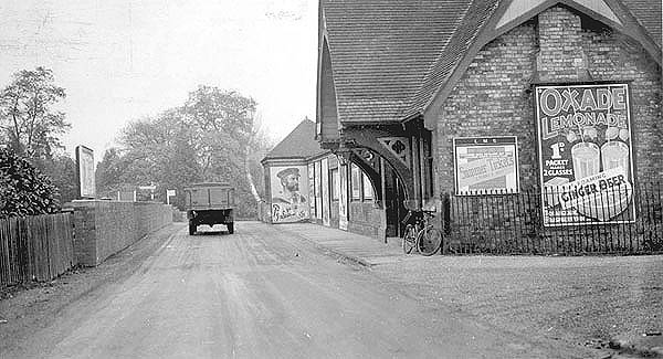 View of both the station building located at road level, which housed the booking office, and the goods yard access road which ran alongside