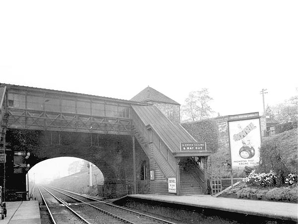 View looking towards Birmingham showing the glazed passenger footbridge which ran alongside the road bridge