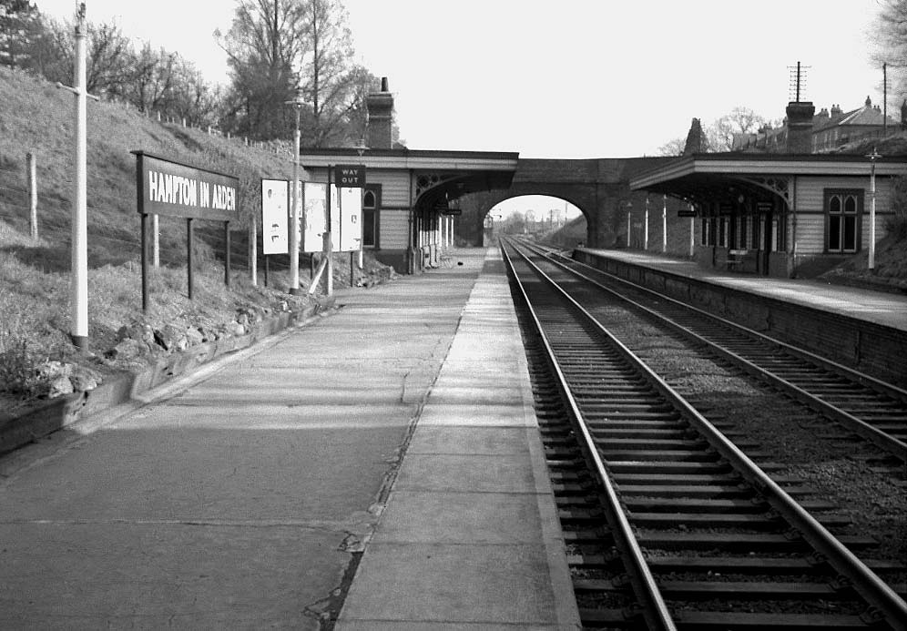 View from the up platform looking towards Coventry of Hampton in Arden station showing the passenger waiting rooms on both platforms