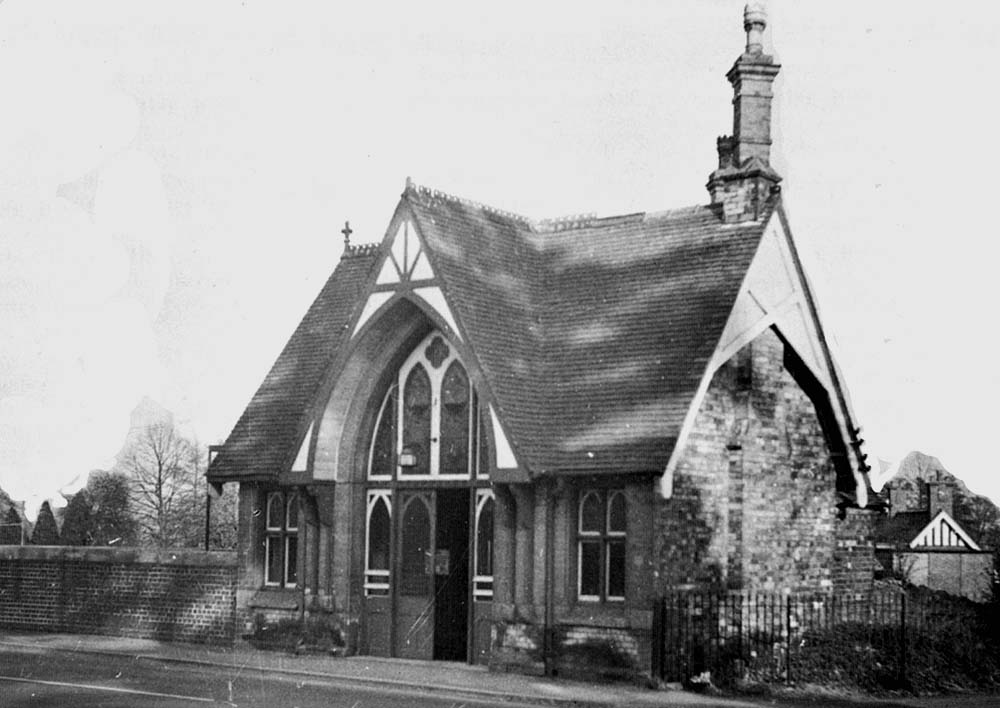 View of the modified station booking hall showing the cantilevered roof over the main entrance much reduced and also the replacement bridge wall