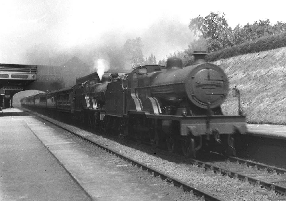 A pair of LMS 4P 4-4-0 Compounds No 1106 and No 1163 are seen at the head of a long up Birmingham to Euston express service
