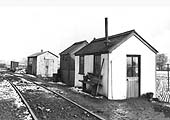 View of the track side huts provided for the different gangs of workmen at Hawkesbury Lane station on 17th February 1956