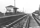 Looking to Nuneaton with the station's down platform on the left and the station master's house on the right