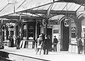 Close up showing Kenilworth station's elegant and ornate canopy ironwork complemented by the Gothic arches to the windows and doors