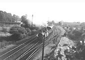 A pair of ex-LNWR 2F 0-6-0 'Cauliflower' No 8519 and No 8430 are seen leaving Kenilworth station at the head a local passenger service