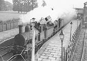 An unknown ex-LNWR 0-6-0 'Cauliflower' locomotive pilots an unknown LMS 4F 0-6-0 locomotives as they run light towards Coventry in 1937