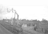 View from Whitemoor Road bridge of an unidentified ex-LNWR 2F 0-6-0 'Cauliflower' locomotive passing Cherry Orchard Brickworks