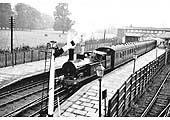 Ex-LNWR 2-4-2T No 6660, at the head of a four-coach local service, is given the right of way to proceed to Coventry station in 1937