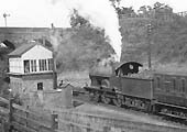Close up showing the ex-LNWR 3P 4-4-0 'Precursor class'  with the signalman standing by the track ready to hand over the train staff