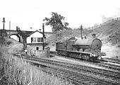 View of Kenilworth Junction Signal Box as ex-LNWR 0-8-0 'Super D' No 9130 slows down to allow the fireman to collect the token