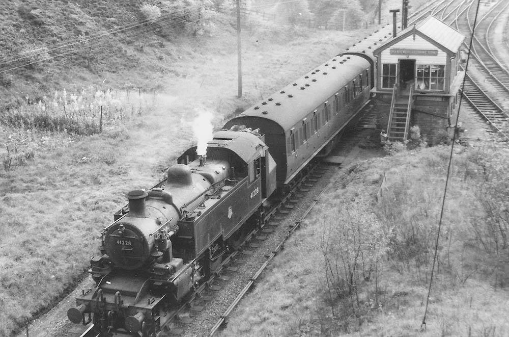 British Railways built Ivatt 2MT 2-6-2T No 41228 draws away from Kenilworth Junction at the head of a two-coach local passenger service
