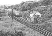 A two-car Diesel Multiple Unit is seen approaching Kenilworth Junction Signal Box where the second man will collect the train staff