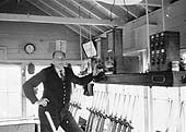 Signalman Frank Prew poses for the camera inside Kenilworth Junction Signal Cabin awaiting for the next train