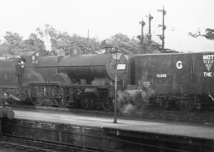 Close up showing a GWR bogie wagon carrying glass from Pilkington Glass to one of Coventry's numerous car plants