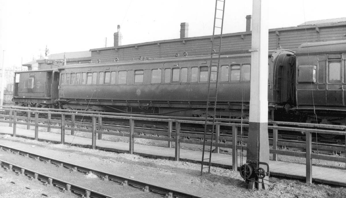 Ex-Lancashire & Yorkshire 3rd class coach No 960 is seen standing on the sidings alongside the GWR station circa 1937