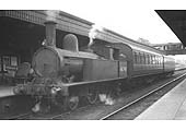 Ex-LNWR 1P 2-4-2T No 46749 is seen standing at platform one at the head of a motor fitted two-coach local passenger train to Weeden