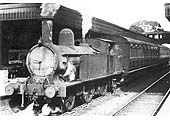 Ex-LNWR 1P 2-4-2T '5 foot 6 inch Radial Tank' No 6683 is seen standing at platform one at the head of a push-pull motor train for Daventry and Weeden