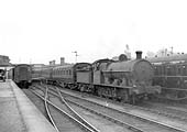 Ex-LNWR 7F 0-8-0 G2a class No 8922 is seen shunting coaching stock at Leamington Avenue station's platform one circa 1938